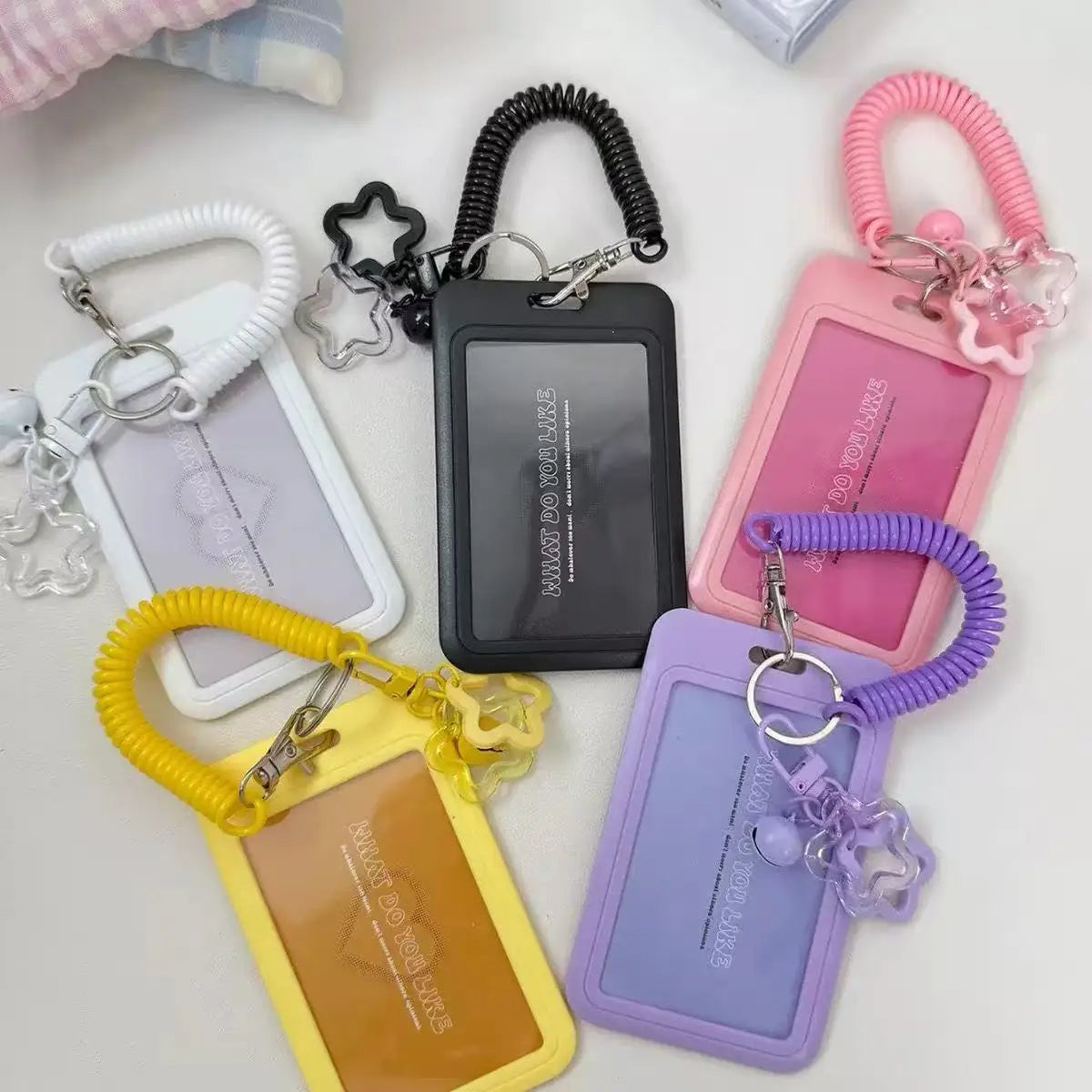 colorful star-shaped retractable plastic ID card holder with keychain. Cute and practical, suitable for bus cards, campus ID,